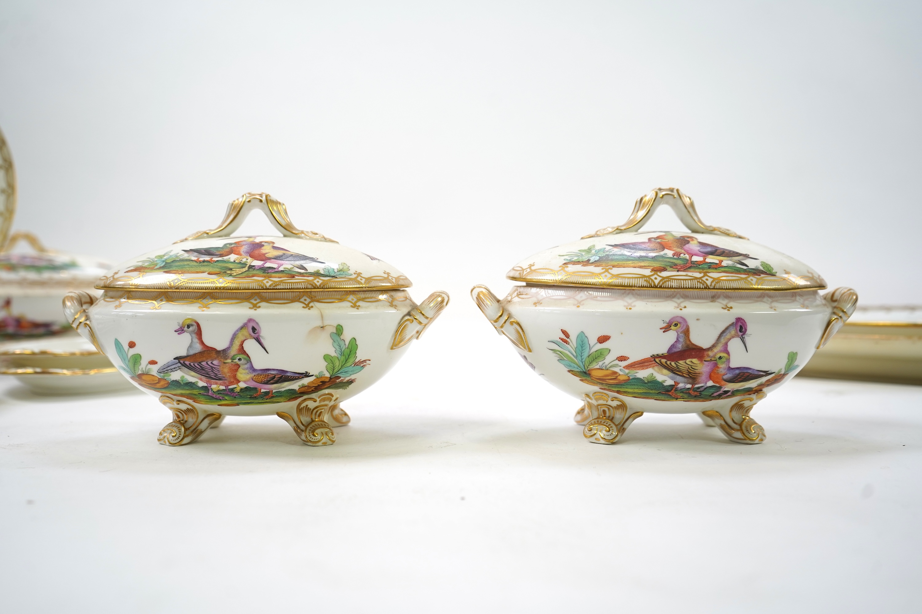 A Coalport bird painted part dinner service, mid 19th century